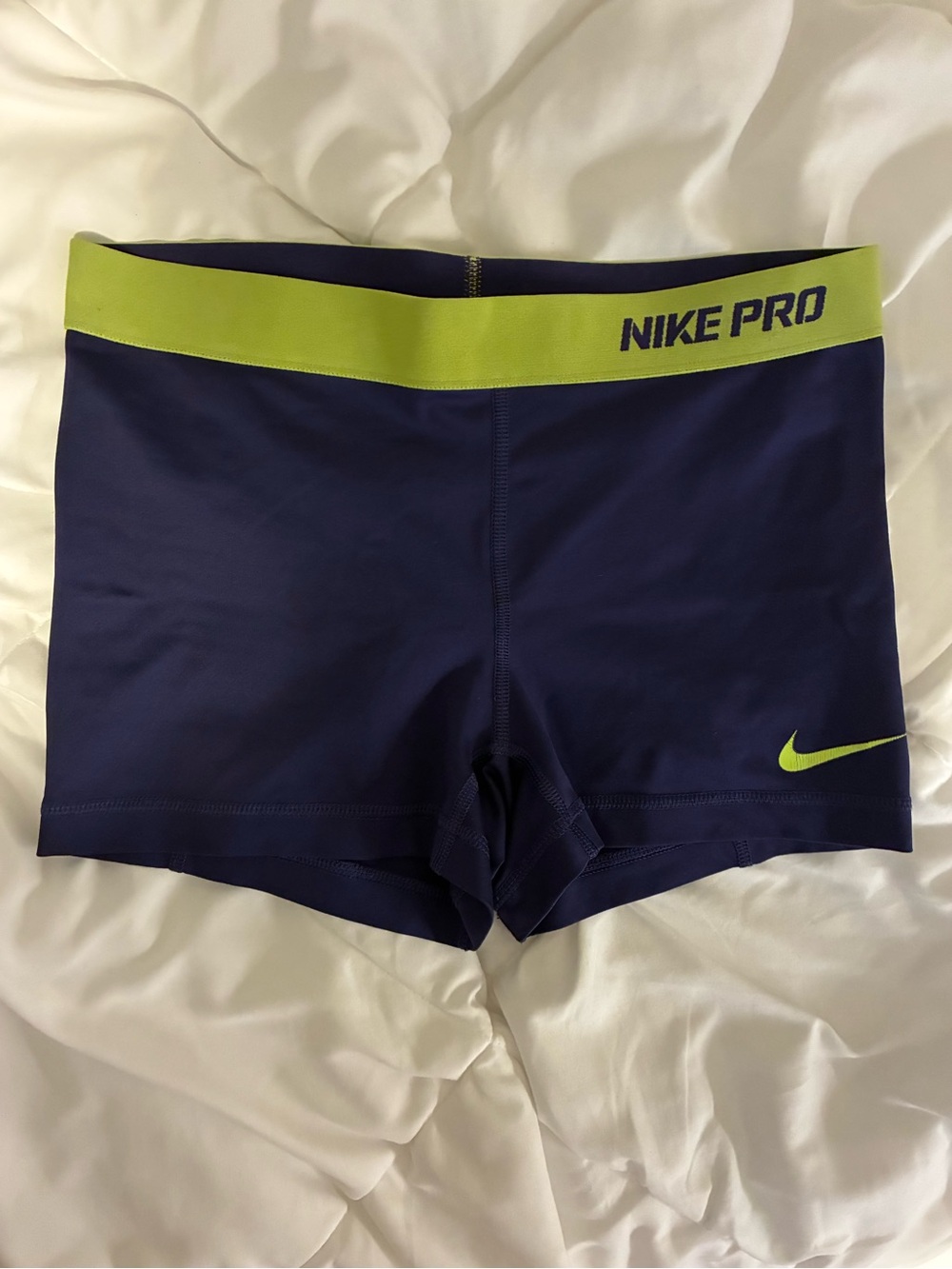 Purple and Neon green Nike pros